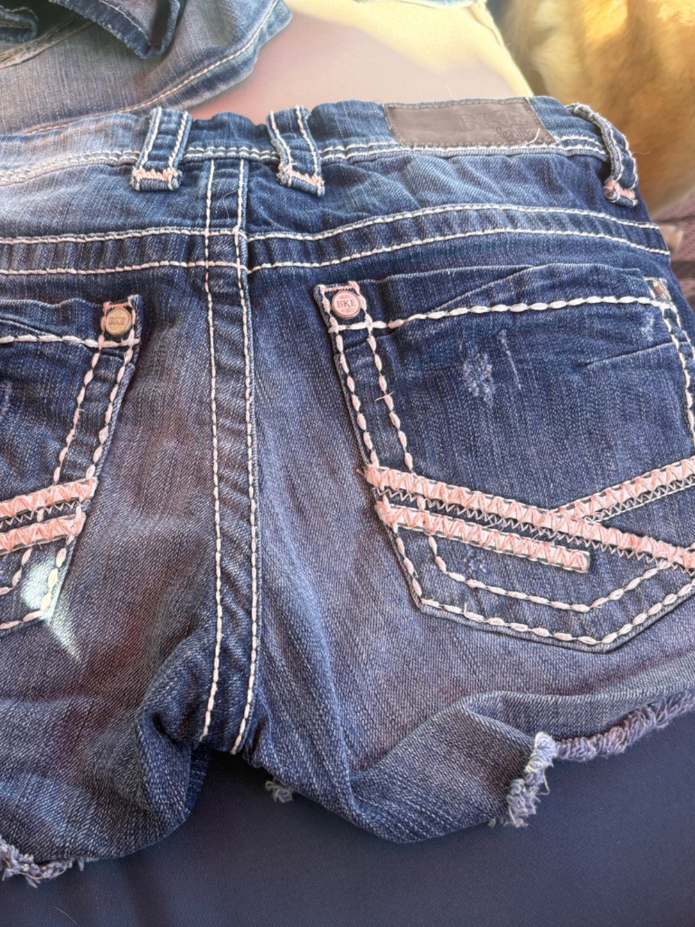 Women's Dark Blue Denim Cutoff Shorts with Pink Accent Stitching
